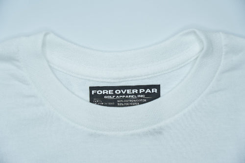 Close-up of a white crewneck t-shirt showing the inner neck label which reads 'FORE OVER PAR GOLF APPAREL,INC'.