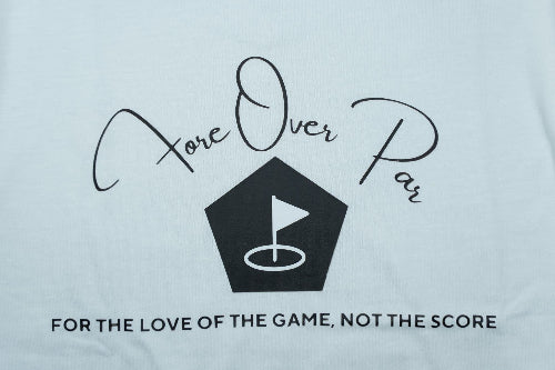 White t-shirt featuring a black graphic print with the words 'Fore Over Par' in cursive, a pentagonal golf hole design with a flag, and the text 'FOR THE LOVE OF THE GAME, NOT THE SCORE' underneath.
