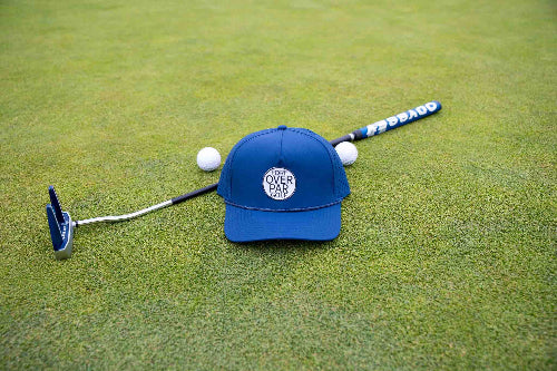 Dark Blue 19th Hole Rope Hat shown on green with a putter and two golf balls behind it 