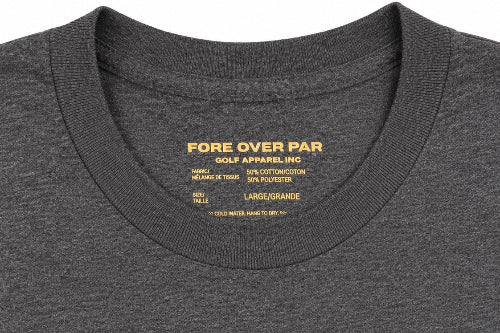 Close-up of a dark heather gray crewneck t-shirt showing the inner neck label with gold text that reads 'FORE OVER PAR GOLF APPAREL INC.'.