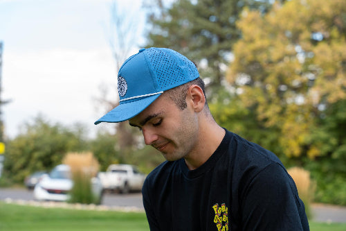 Male wearing Light Blue 19th Hole Rope Hat by Fore Over Par on golf course