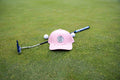 Pink 19th Hole Rope Hat by Fore Over Par shown on a green with a putter and two golf balls behind it
