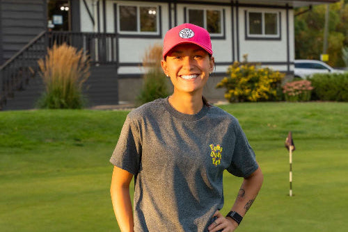 5'1" Female wearing a pink Pony Tail Club hat and Small Grey Fringe Society Club Tee Shirt by Fore Over Par on a golf course. 